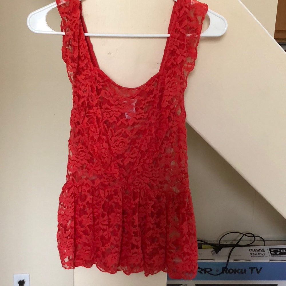 Brand new bright peach colored lace top